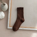 Dark brown rib-knit crew socks with lettuce edge trim and retro minimalist aesthetic - One Size / Coffee