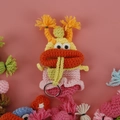 Handmade crochet sausage mouth key case in multi-color yarn with ponytail design - Pink with Curled Braids