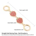 Red strawberry bag chain accessory with golden clasps and enamel leaf charms - Gold Spring Buckle - Red Strawberry