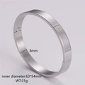 Polished silver stainless steel bangle detail showing 8mm width and 63x54mm inner diameter - Men's Steel Color