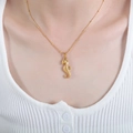 Golden seahorse pendant necklace on model featuring delicate beaded twist chain design - P1584-Seahorse Pendant-Ball Chain