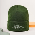 Close-up of snake embroidery on dark green knit beanie showing texture and details - Embroidered Snake / Army Green
