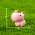 Pink Capybara miniature figurine with orange hat on green grass, size 2.6x2.3cm - Basic Capybara (Light Pink)