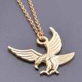 Close-up of a detailed golden eagle pendant necklace with polished metallic finish - Gold Color + Necklace Chain