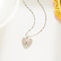 Elegant silver heart pendant necklace with shimmering diamonds on white background - Silver