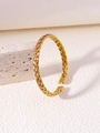 Detailed macro view of golden twisted texture cuff bangle with polished ends - Gold