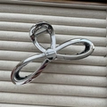 Detail of silver metallic bow hair claw clip with a high-gloss electroplated finish - Large Bowknot Silver 13cm