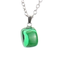 Macro detail of irregular green malachite pendant with silver tone link chain - Silver + Malachite