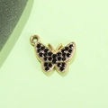 Macro shot of butterfly pendant with gold frame and black rhinestones for DIY jewelry - Black Butterfly UV Gold Plated