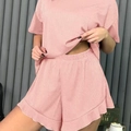Pink ribbed two-piece lounge set with short sleeve top and ruffle shorts for women - S / Pink