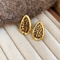 Detail of leaf-shaped leopard print earrings with gold frames on a beige tray - Silver Earring Post Real Gold Plated / Gold