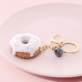 Handmade crochet donut keychain with white frosting, pink sprinkles and a gold bell - Donut-White
