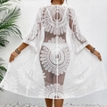 Close-up of white lace floral embroidery on a sheer beach cover-up with wavy edges - One Size / White