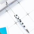 DIY beadable pen featuring a white body with black cat paw prints and metal rod detail - White Cat Paw Print Pattern (1)