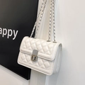 Close-up of white quilted leather chain bag with silver clasp and flap detail - White