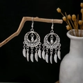 Silver dreamcatcher earrings with metal feathers hanging on a branch in bohemian style - Dreamcatcher Feather Tassel Style (E2873-26)