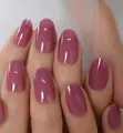 Detail of almond-shaped dusty rose press-on nails with a glossy mirror finish on hand - Bean Paste Pink Oval Style (CW241) / 24 Pcs/Set