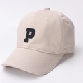 Detail showing the black embroidered letter P on a beige cotton baseball cap with air vents - Kids (2-8 Years) / Beige