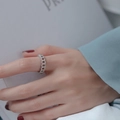 Silver chain ring with micro-set zircons worn on model finger for elegant look - Style B Twist