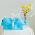 Pair of blue whale inflatable arm rings for kids placed on a white tablecloth - Blue Whale Arm Bands