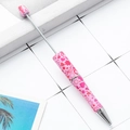 DIY beadable pen with creative pink heart and star patterns on a white tile surface - Pink Hearts and Stars Abstract (94)