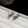 Macro detail of silver triangular hoop earrings with pavé zircons on grey velvet tray - Silver Base White Zirconia (Silver Needle - Silver)