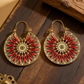Detail of round golden bohemian earrings with red woven thread on a rustic wood background - 07 Antique Gold WG-0130