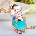 Rose gold sneaker keychain with blue rhinestones, white enamel, and heart charm - Blue Jelly Sneakers