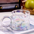 Iridescent glass mug with honeycomb texture and handle in a cozy lifestyle setting - Iridescent Raindrop Pattern Mug