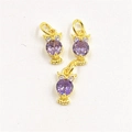 Macro detail of owl pendants with purple zircons and gold plated finish for necklaces - Pendant Only / Purple