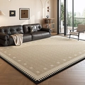 French vintage beige woven rug with black scalloped edges on a wooden floor - Persian Velvet - Sky Dome