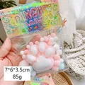 Squishy cat paw stress relief toy with colorful fluff balls in transparent package - Pink Plush Cat Claw