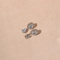 Macro detail of silver drop earrings with faceted zircon stones on a matte stone surface - Silver Needle - Silver Waterdrop Zirconia Earrings