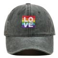 Close-up detail of washed grey baseball cap with rainbow LOVE embroidered patch. - One Size / Army Green