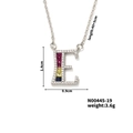 Macro view of letter E pendant with pink blue and yellow crystals on a silver chain - Letter E Style (N00445-19)