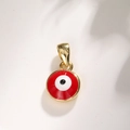 Macro detail of a round gold-plated red evil eye pendant with a polished finish - A022 Gold Red Eye 8mm