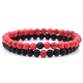 Close-up of 6mm red and black beaded distance bracelets for couples in stacked layout - Red Turquoise