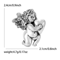 Retro antique silver cupid angel brooch featuring wings hugging a heart - Antique Silver