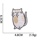 Detailed size view of cartoon cat embroidery patch measuring 6.5cm by 4.8cm with 1.9g weight - No.16 (Tan White Cat)
