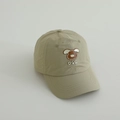 Detail of laser-cut ventilation holes and dog embroidery on quick-dry kids baseball cap - 52-54cm (3-8 Years) / Matcha Green