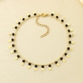 Golden titanium steel anklet with black beads and leaf-shaped pendants in a variant view - Black Beads Waterdrop Style (KJ3546-Z)