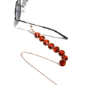 Detail of amber octagonal crystal beads on a gold metal eyeglass chain and mask strap - Amber