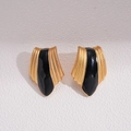 Detailed view of vintage gold earrings with black enamel inlay in a geometric shield shape - Stud Earrings with Silver Pin (Gold/Black)