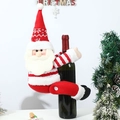 Detail of knitted Santa wine bottle cover with snowflake pattern and plush textures - Red Hugging Santa Bottle Decor