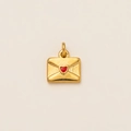 Macro shot of a gold-plated envelope pendant with a red enamel heart seal for DIY jewelry - Envelope 7mm
