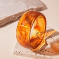 Macro detail of amber resin bangle showing translucent texture and artistic patterns - Dark Coffee Smooth Bangle (95#)