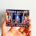 3D New York Times Square souvenir fridge magnet held by hand on a white backdrop - (25) Times Square New York