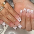 Close-up of pink and white press-on nails featuring 3D bows and snowflake designs - No Accessories Style / X-0435 Pink White Bow Snowflake