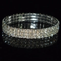 Macro shot of silver three-row rhinestone elastic bridal bracelet with mirror reflection - 3 Row Silver Clear Rhinestone Bracelet
