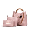 Pink 3-piece bag set with geometric monogram pattern and tassel charm on white backdrop - Pink